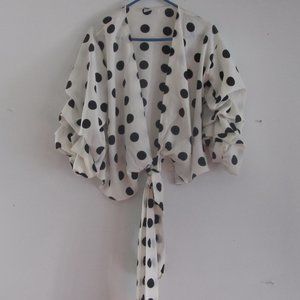 This Soft-Flowing Blouse is decorated with polka-dots